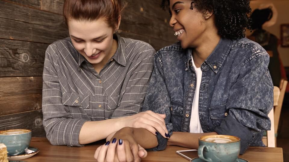 Young couple sharing happy moment together at cafe